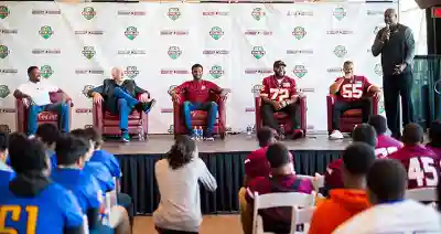 Football players address the crowd