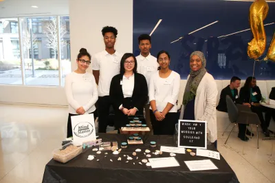 students presenting their company and selling their product