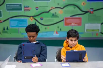 Students looking at their tablets
