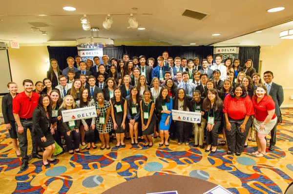 students alongside Delta volunteers