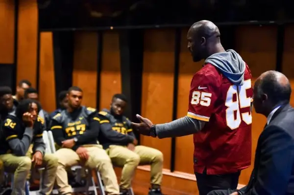 a man speaks to students