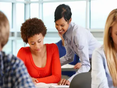 teacher looking at a student's work