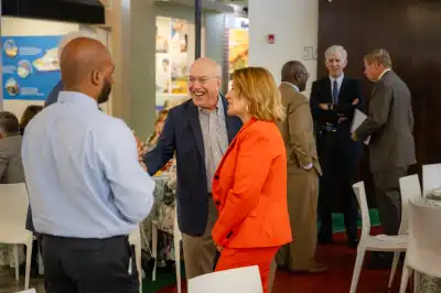 Kurt Newman and Susan Lacz speaking with guests.